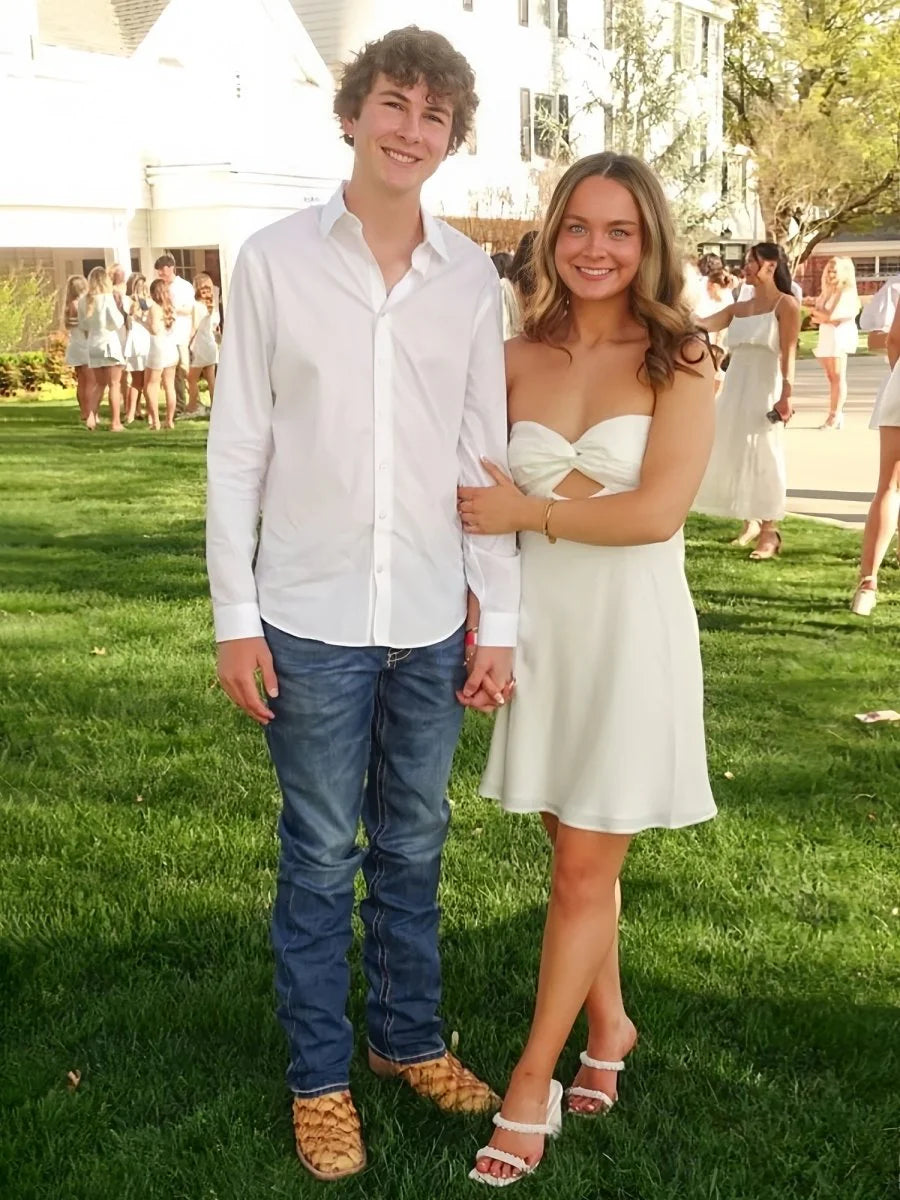 Model posing gracefully in the short A-line party dress.