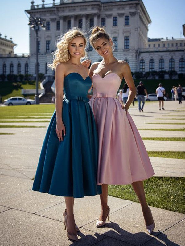Elegant A-Line sweetheart satin tea-length homecoming dress with a bowknot detail.