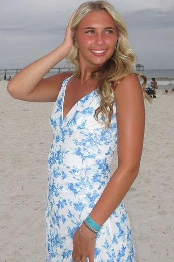 Model wearing a V-neck print bodycon homecoming dress with spaghetti straps, back view.