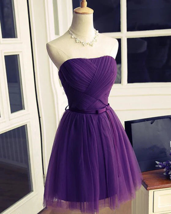 Back view of an elegant short purple homecoming dress.