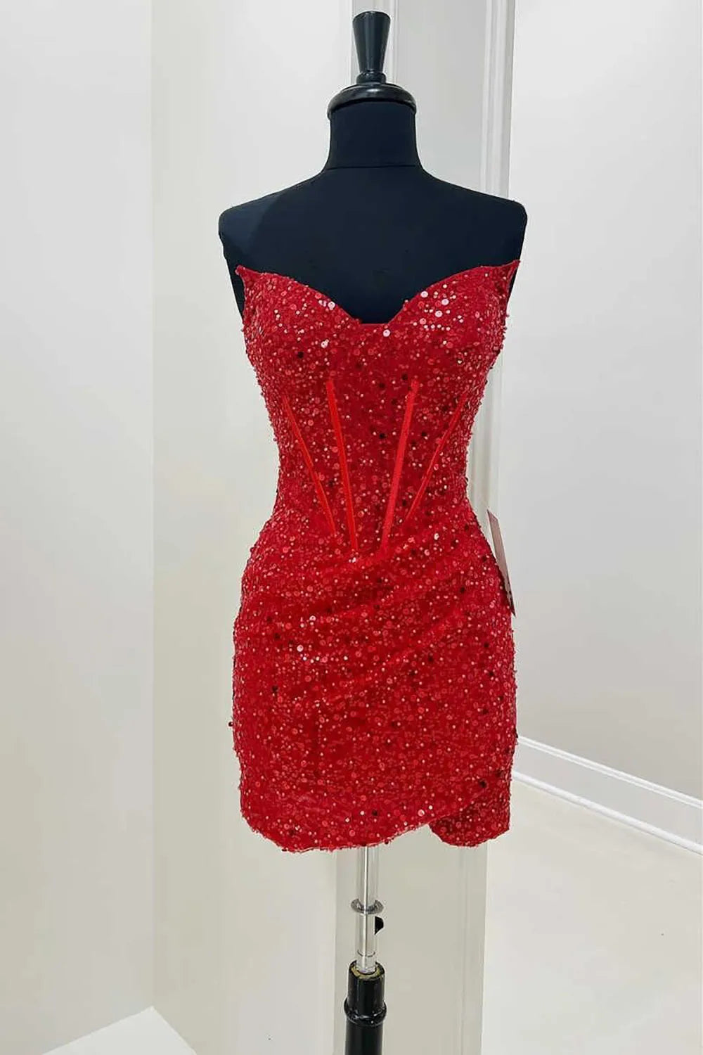 Full length view of the red sequin sweetheart homecoming dress.