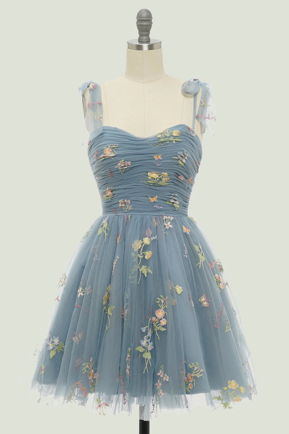 Grey-blue A-line homecoming dress, featuring a flattering silhouette and spaghetti straps.