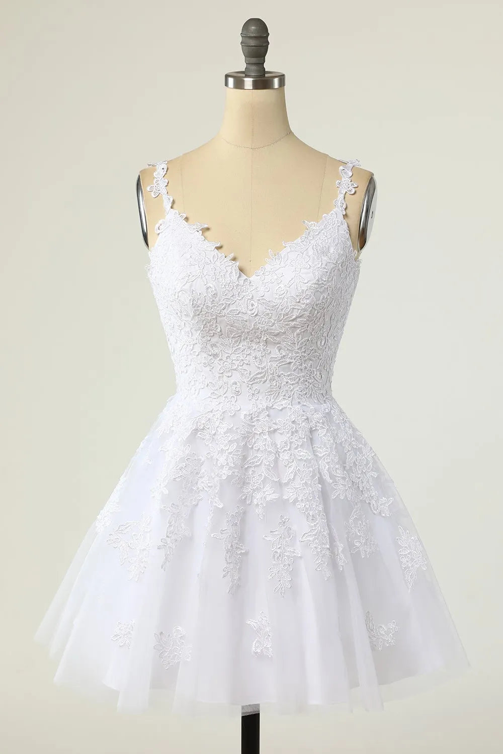 Close-up of the V-neckline and spaghetti straps on the purple tulle dress.
