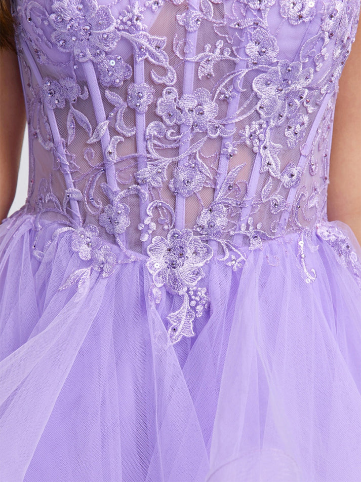 Back view of an elegant short beaded tulle ball gown homecoming dress with spaghetti straps.