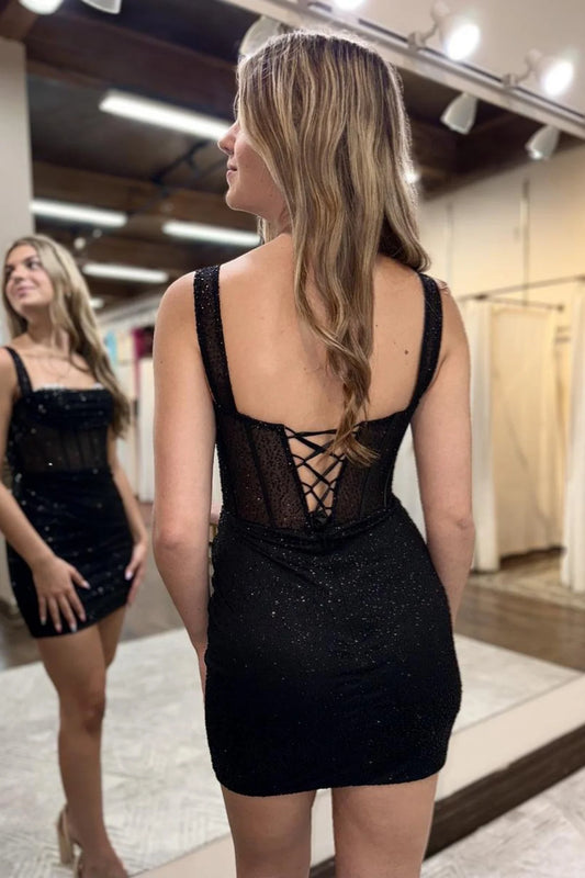Model wearing Koutun off-shoulder black beaded short homecoming dress, side view.
