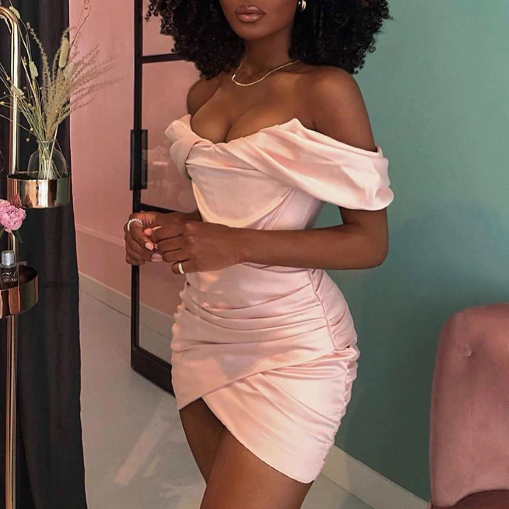 Side profile of the off-shoulder satin mini dress.
