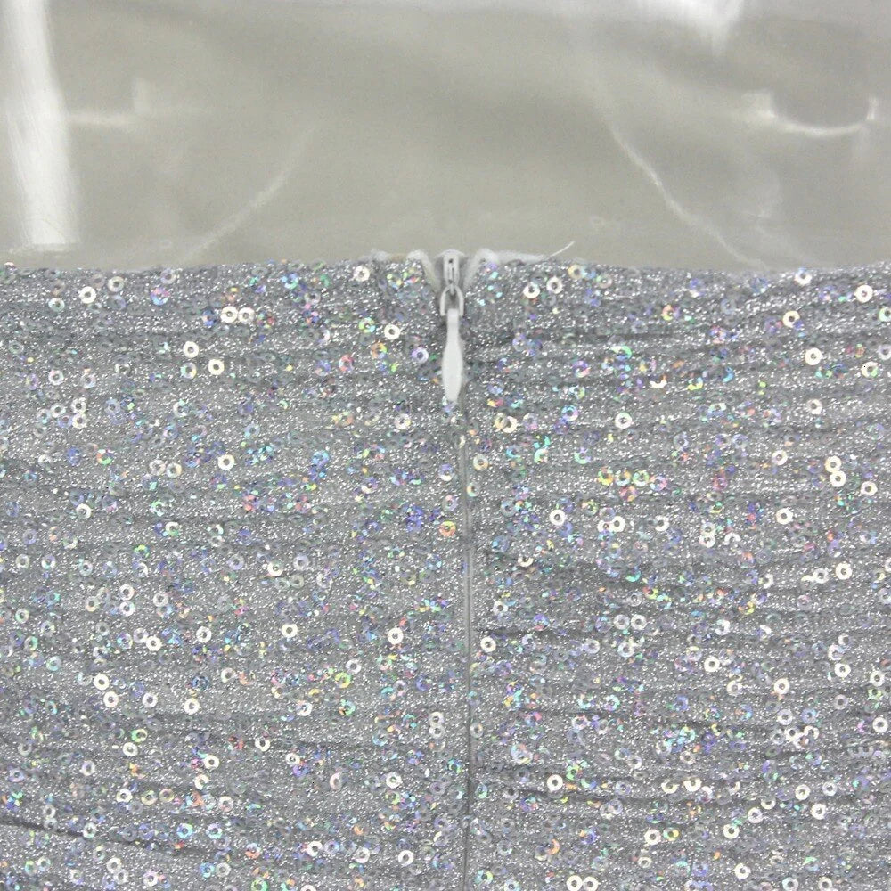 Back view of the silver grey short dress, highlighting its elegant silhouette.