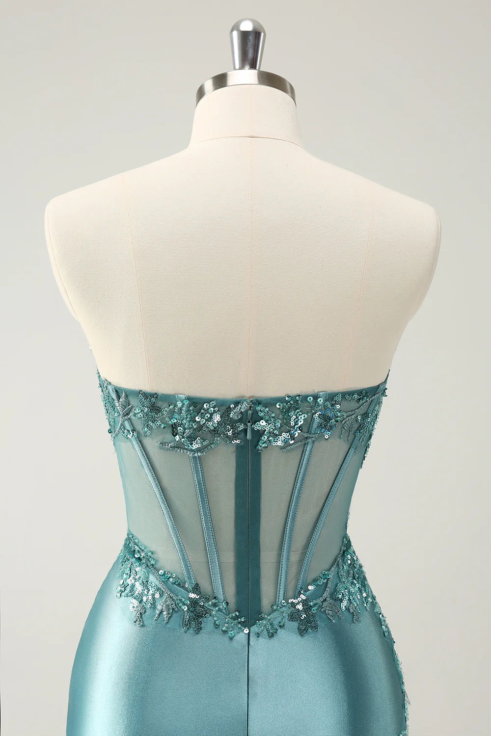 Side view of the floor-length strapless homecoming dress.