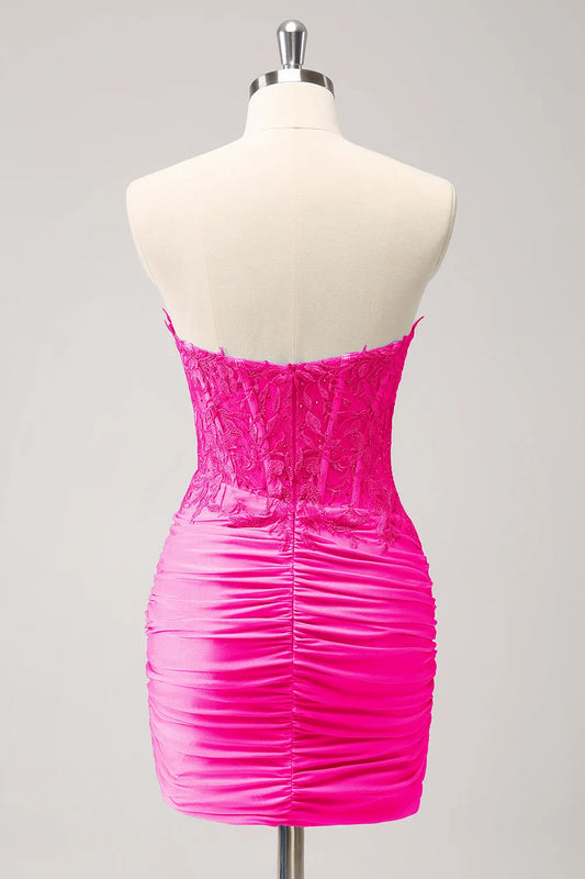 Back view of fuchsia bodycon homecoming dress with beaded details.