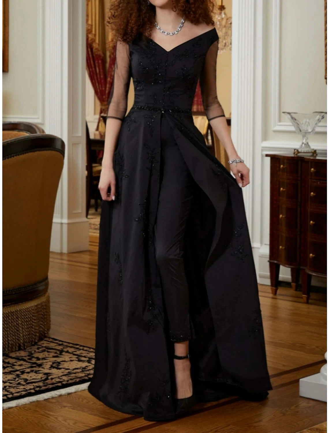 Back view of the elegant jumpsuit gown showcasing the sweep train.