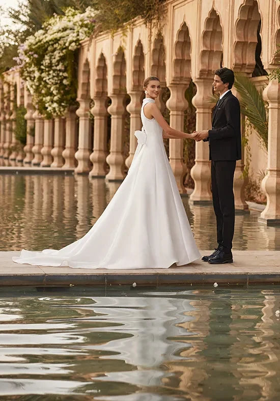 Elegant A-Line High-Neck Sleeveless Bow-Back White Floor-Length Wedding Gown