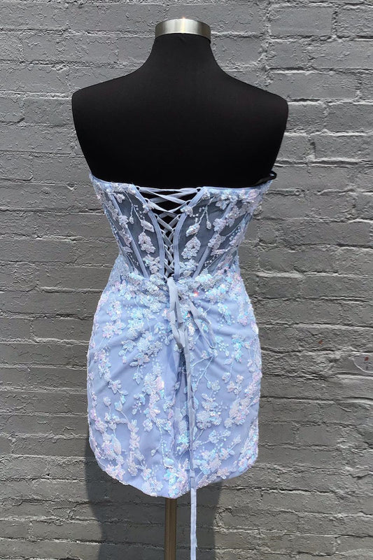 Close-up of the blue sequin appliques on the Koutun strapless dress.