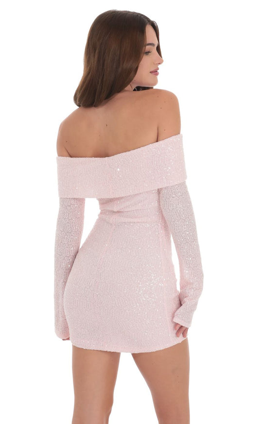 Back view of the pink sequin off-shoulder mini dress, showing the fitted silhouette.