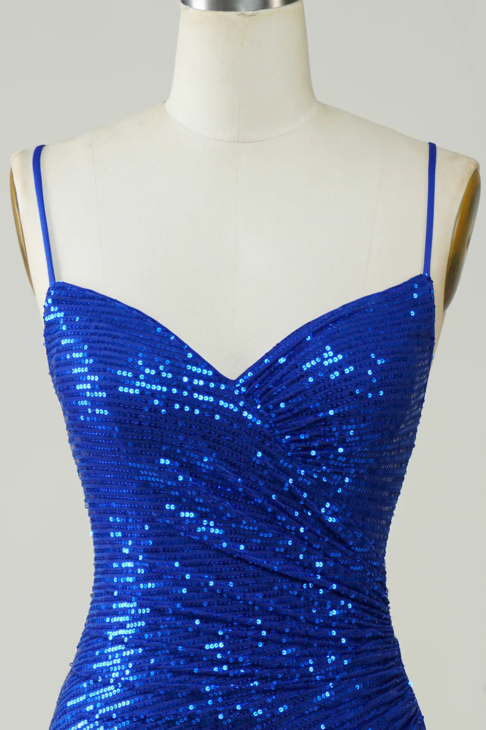 Close-up of the sequin detail on a royal blue bodycon dress.