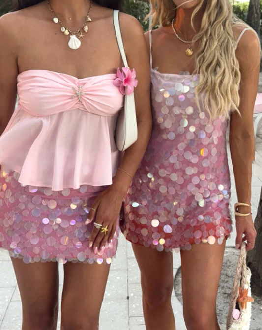 Back view of a sparkling pink sequin short cocktail dress.