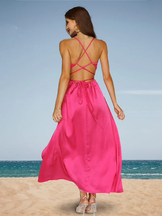 Woman wearing a minimalist charmeuse prom dress, side view, showing the flowing ankle-length skirt.