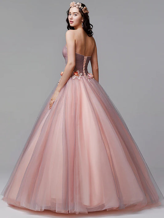Close-up of the floral details and pleated bodice on the ball gown.