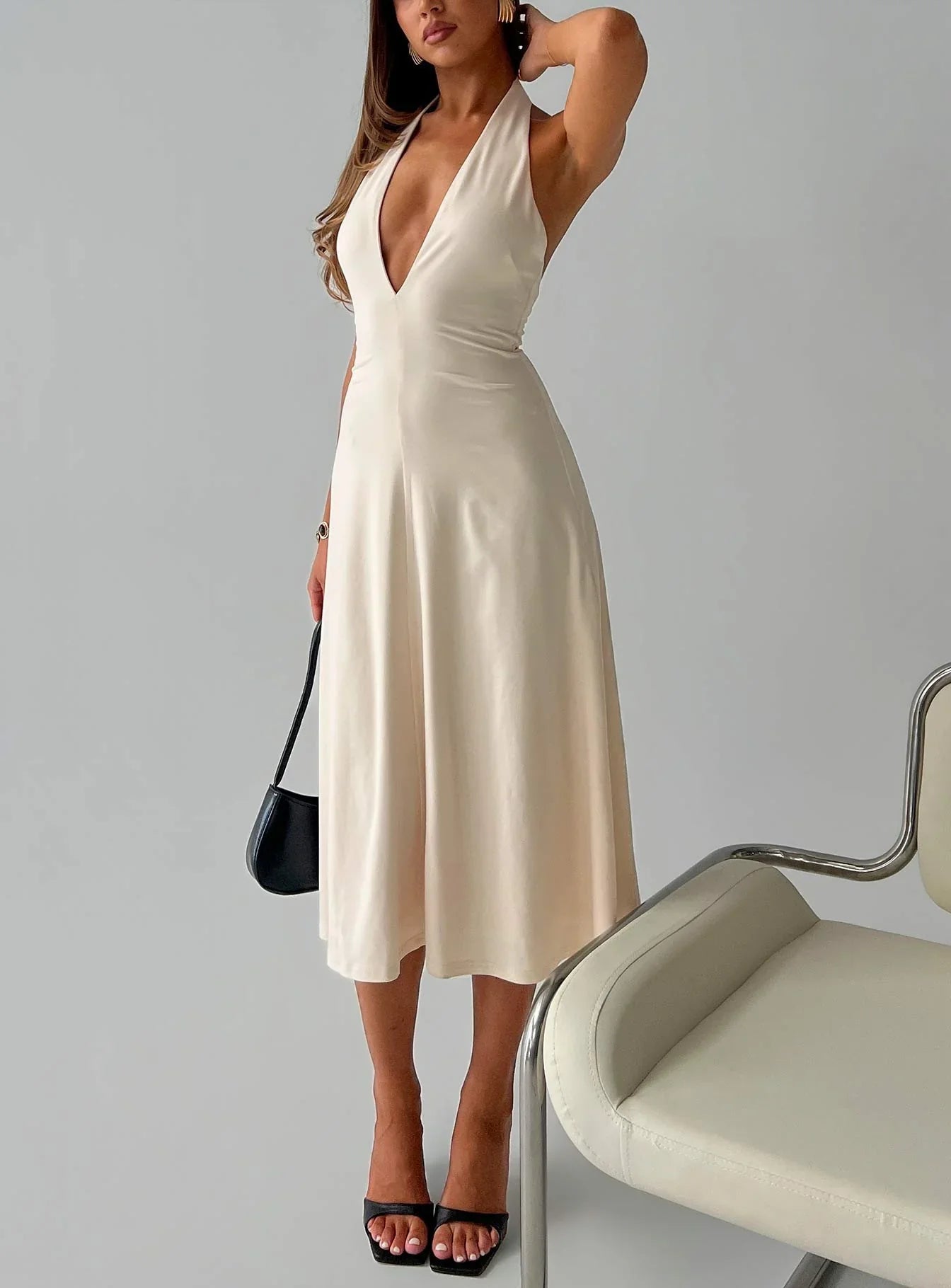 Beige Halter Prom Dress with Deep V Neckline and Flowy Midi Skirt for Formal Events and Prom Nights