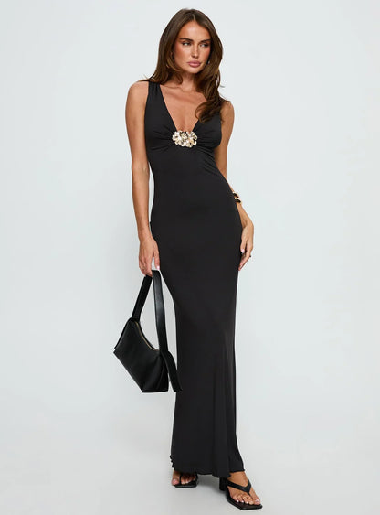 Black Sleeveless Prom Dress with Gold Flower Detail and Mermaid Silhouette for Formal Events and Prom Nights