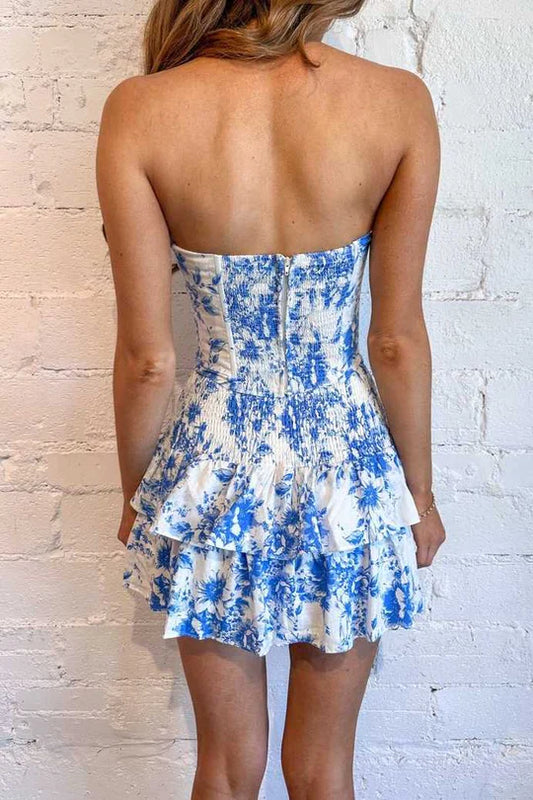 Side view of a blue and white strapless ruffled dress, ideal for homecoming events.