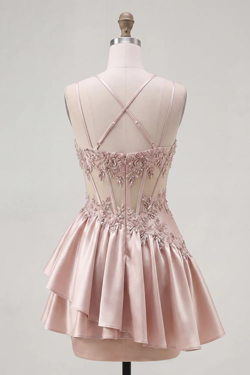 Detail of ruffled overlay on the blush pink homecoming dress.