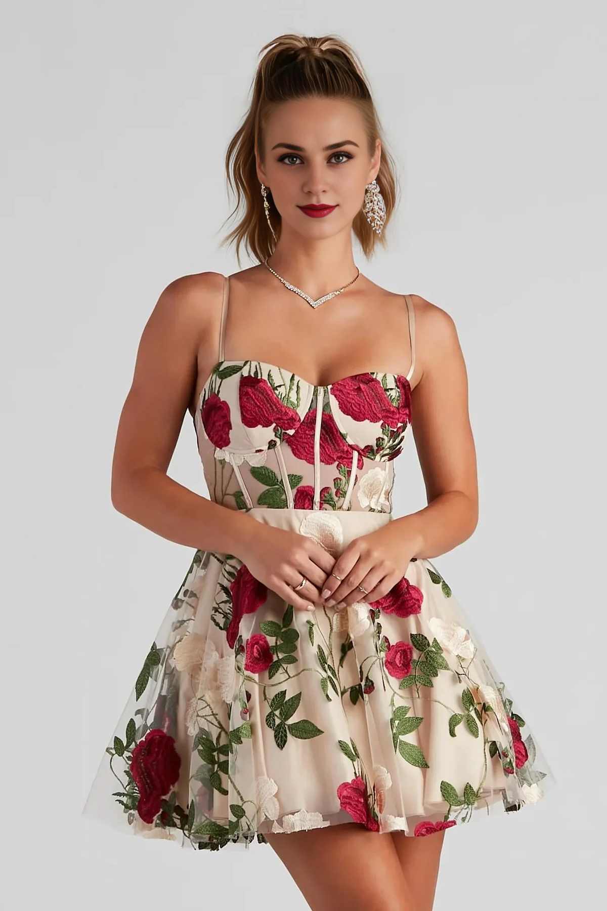 Woman wearing a charming A-line floral bustier mini homecoming dress.