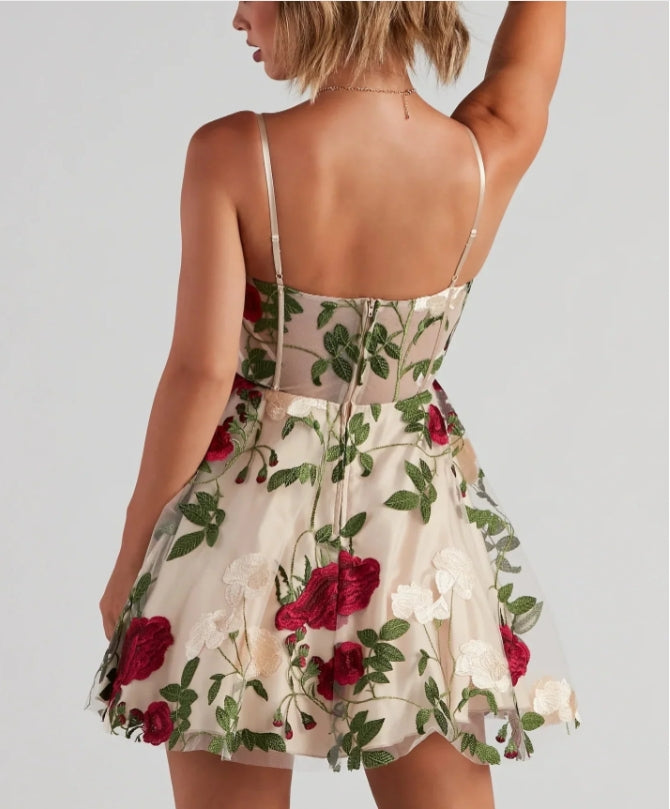 Close-up of the floral pattern and bustier detail on the mini dress.