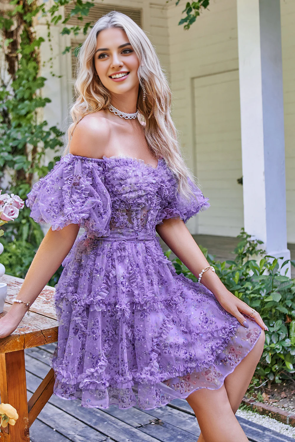 Close-up of the printed tulle fabric on the off-shoulder A-line dress.