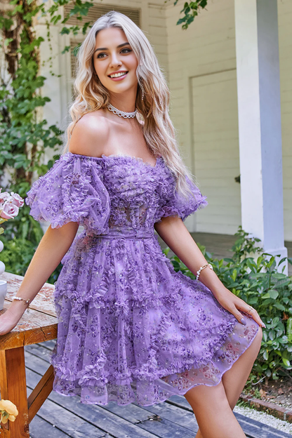 Close-up of the printed tulle fabric on the off-shoulder A-line dress.