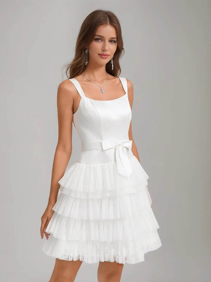 Close-up of the bow detail on the A-line princess short homecoming dress.
