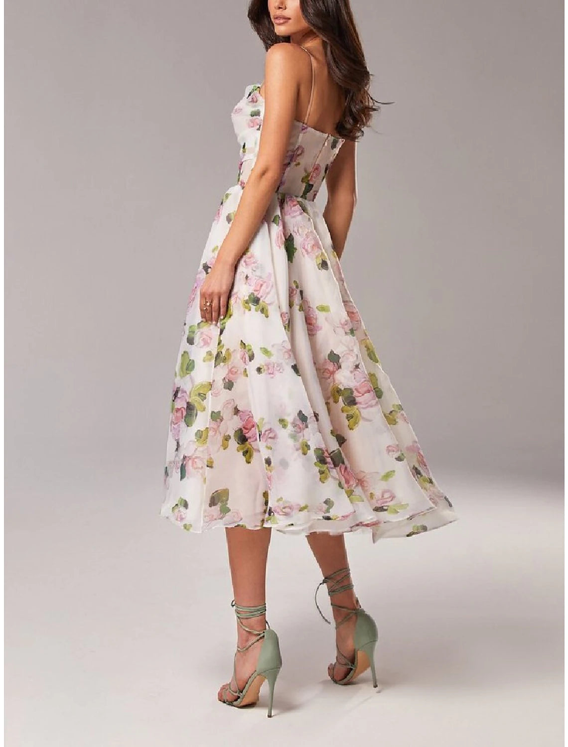 Close-up of the printed organza fabric on the A-line dress.