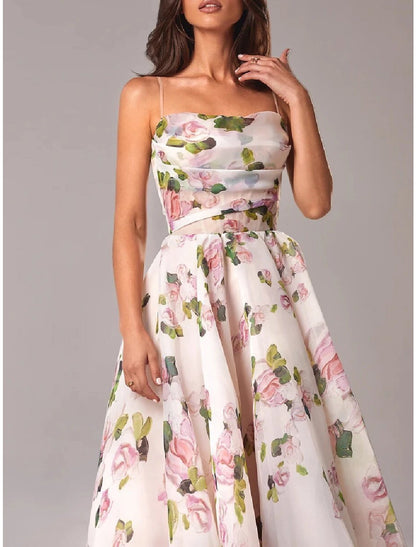 Back view of the A-line tea length dress with spaghetti straps.