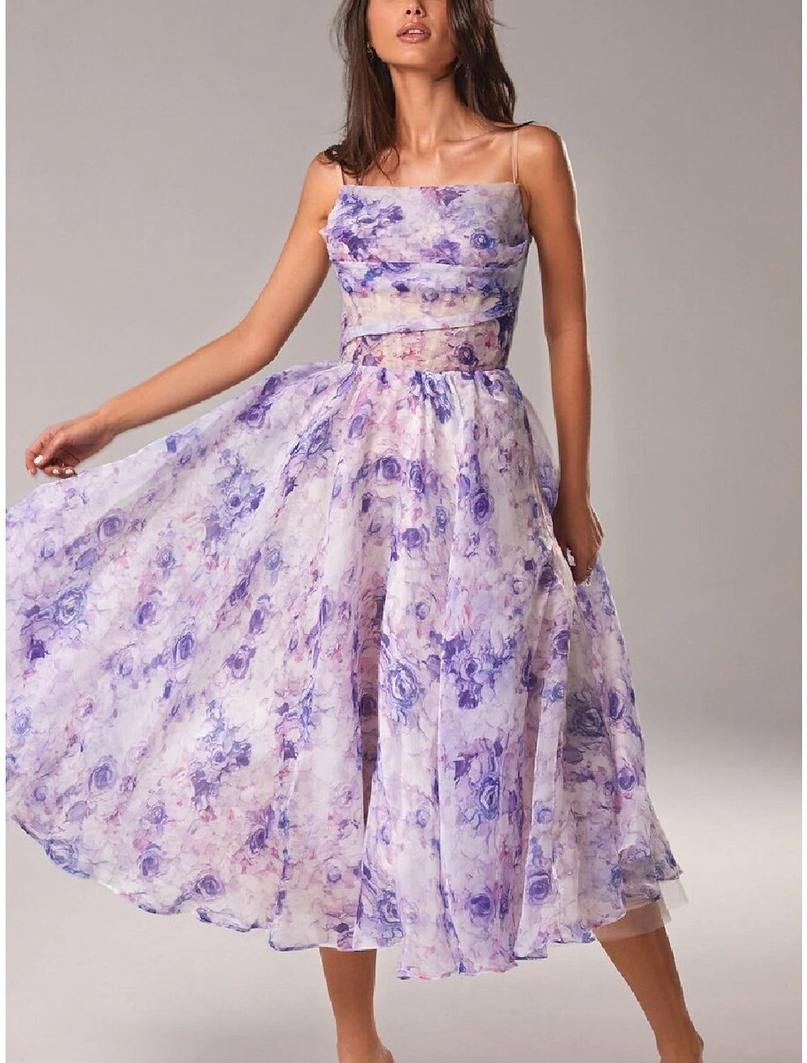Model posing in the elegant A-line printed dress.