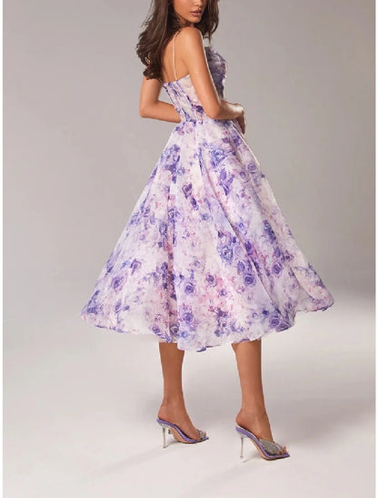 Side view of the tea length spaghetti strap dress.