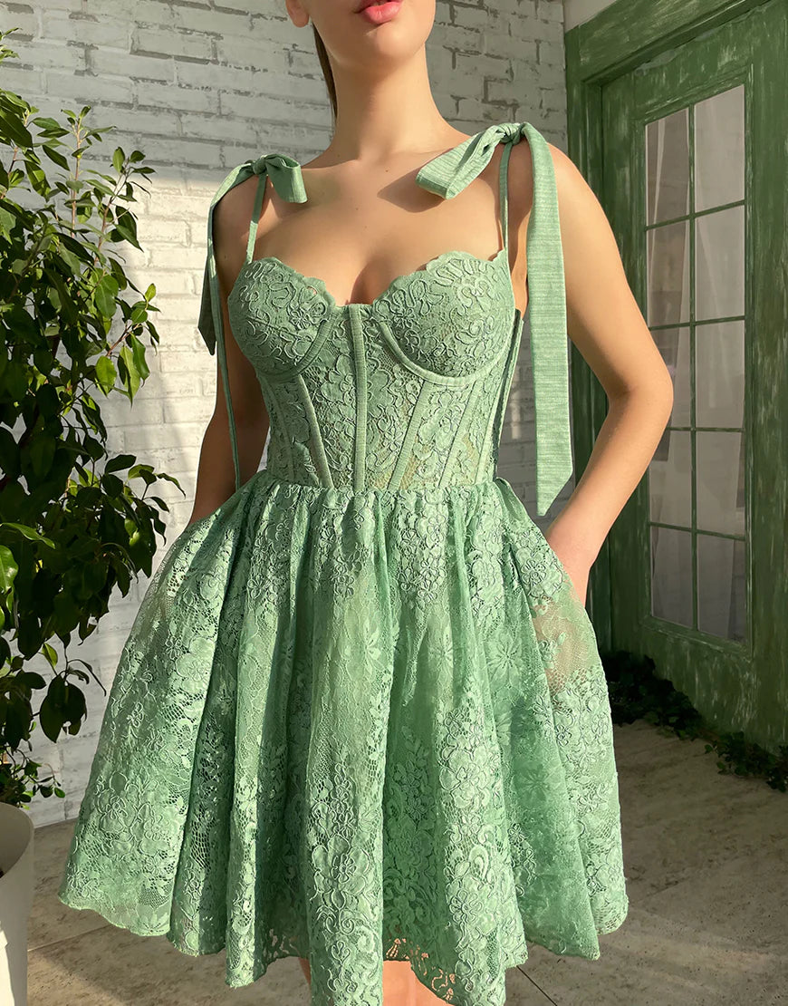Model wearing a green A-line sweetheart short homecoming dress.