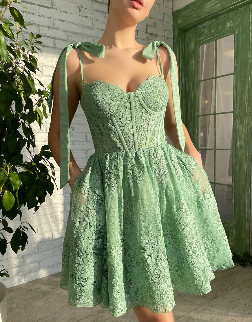 Back view of the green A-line sweetheart short dress.