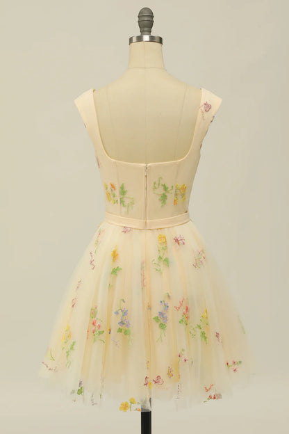 Back view of a model in a grey-blue floral print A-line homecoming dress.