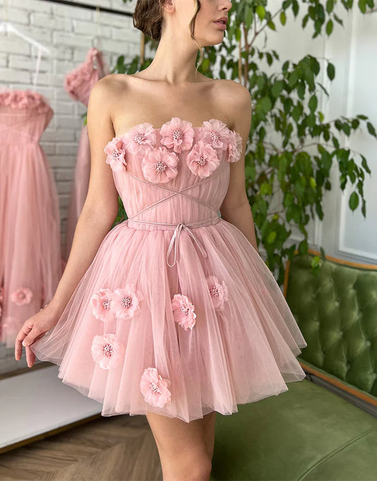 Woman wearing an A-line V-neck short homecoming dress with floral appliques.