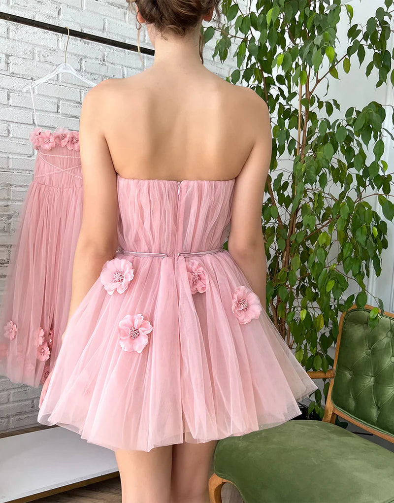 Back view of the A-line short homecoming dress showing floral appliques.