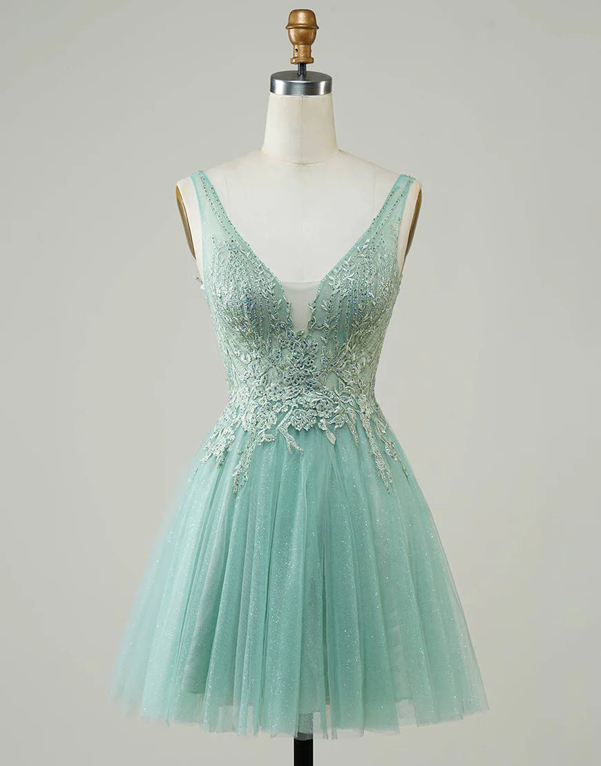 Model wearing a blue A-line V-neck homecoming dress with appliques.