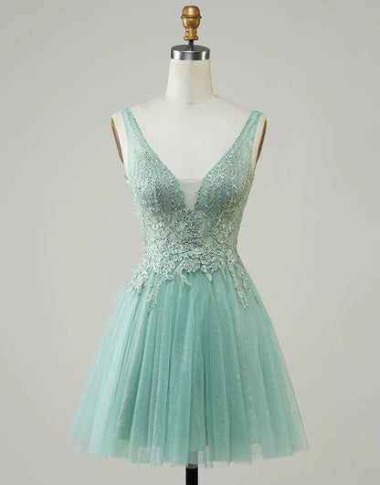 Model wearing a blue A-line V-neck homecoming dress with appliques.