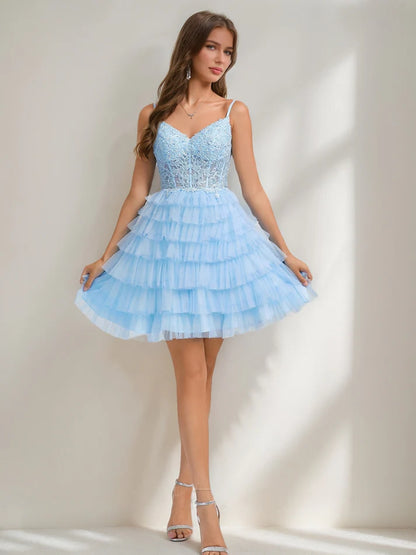 Close-up of the appliques and ruffle details on the A-Line homecoming dress.
