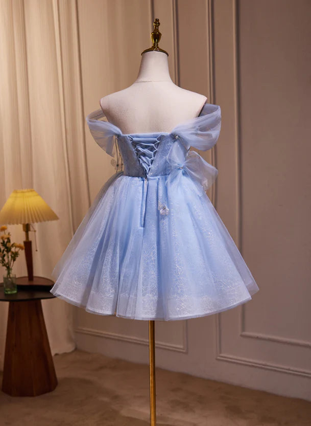 Model wearing a blue A-line off-shoulder knee-length dress.