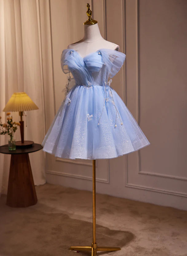 Close-up of the off-shoulder detail on the blue A-line dress.