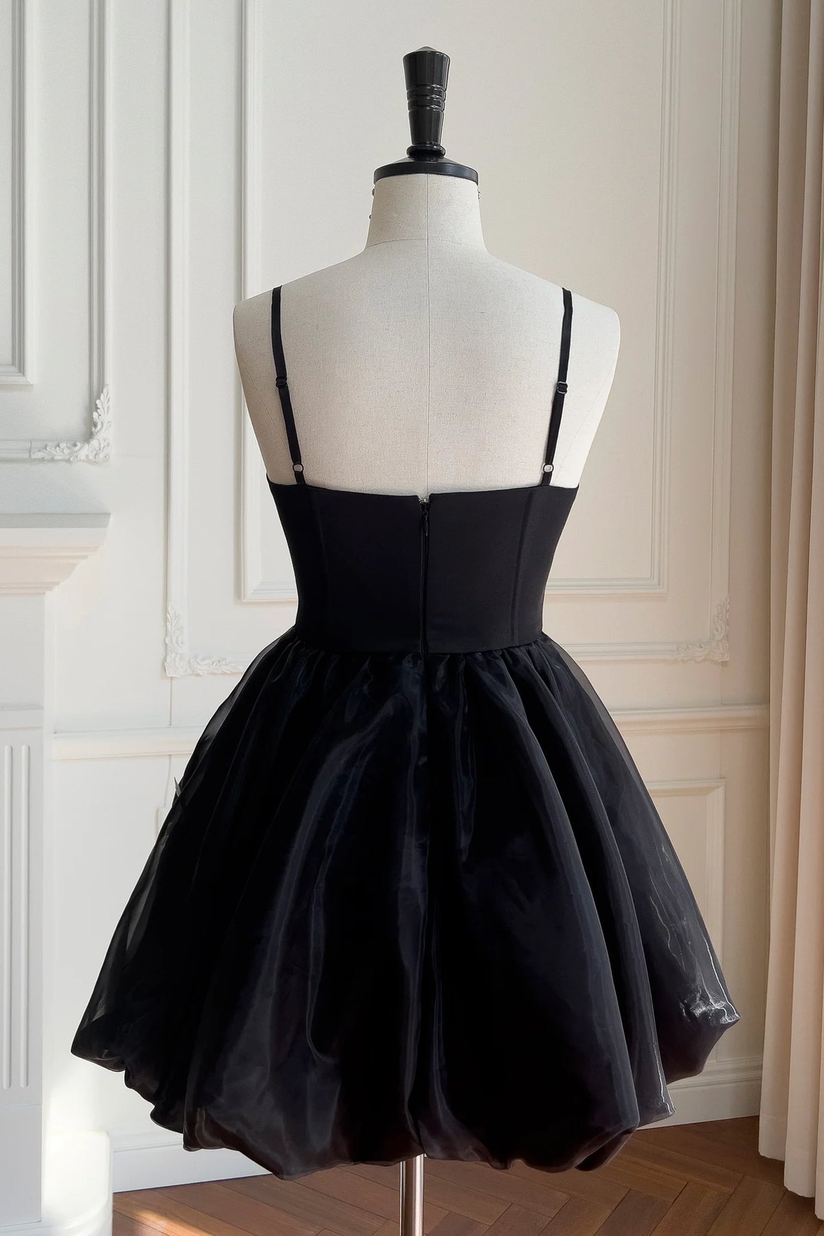 Close-up of 3D butterfly details on Koutun black short dress.