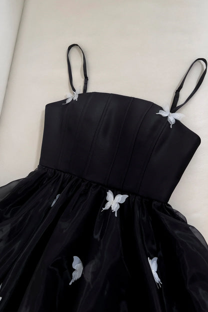 Side view of Koutun black short dress, highlighting the A-line cut.