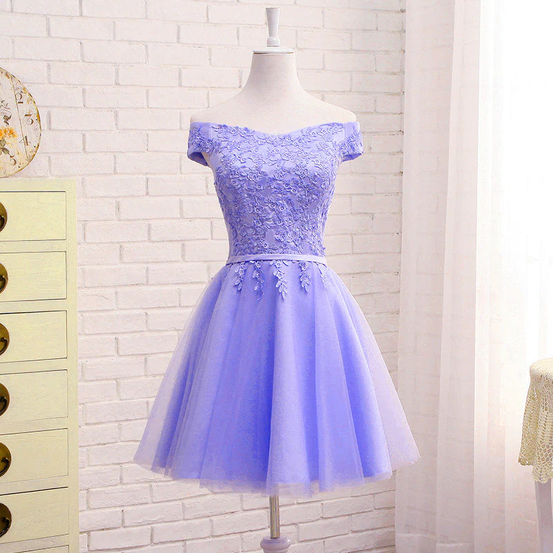 Close-up of purple lace detail on an off-shoulder dress.