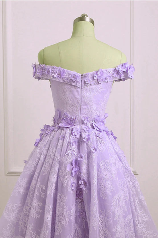 Back view of a light purple lace high-low dress, showcasing the flowing skirt.