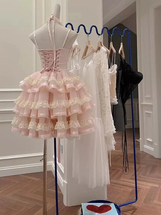 Close-up of pink halter corset dress bodice with lace-up back.