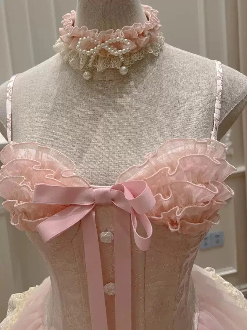 Model in pink halter corset mini dress, showcasing tiered lace.